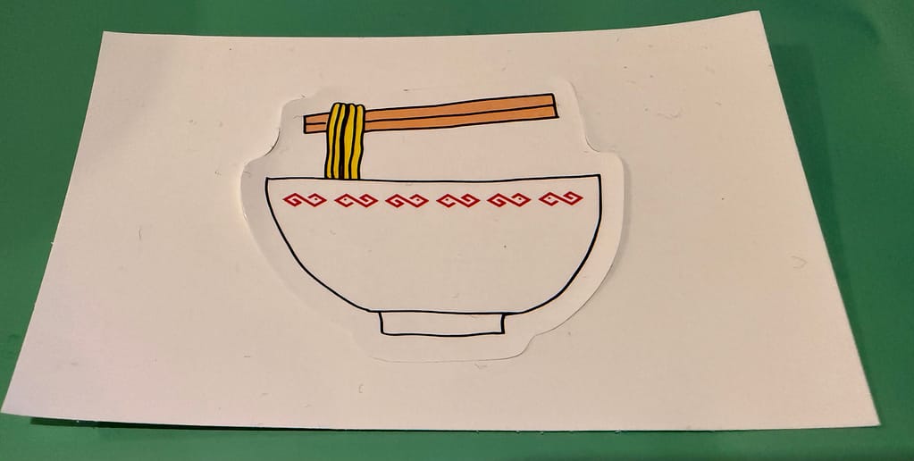 ラーメン丼と箸を描いたシンプルなイラストのステッカー。